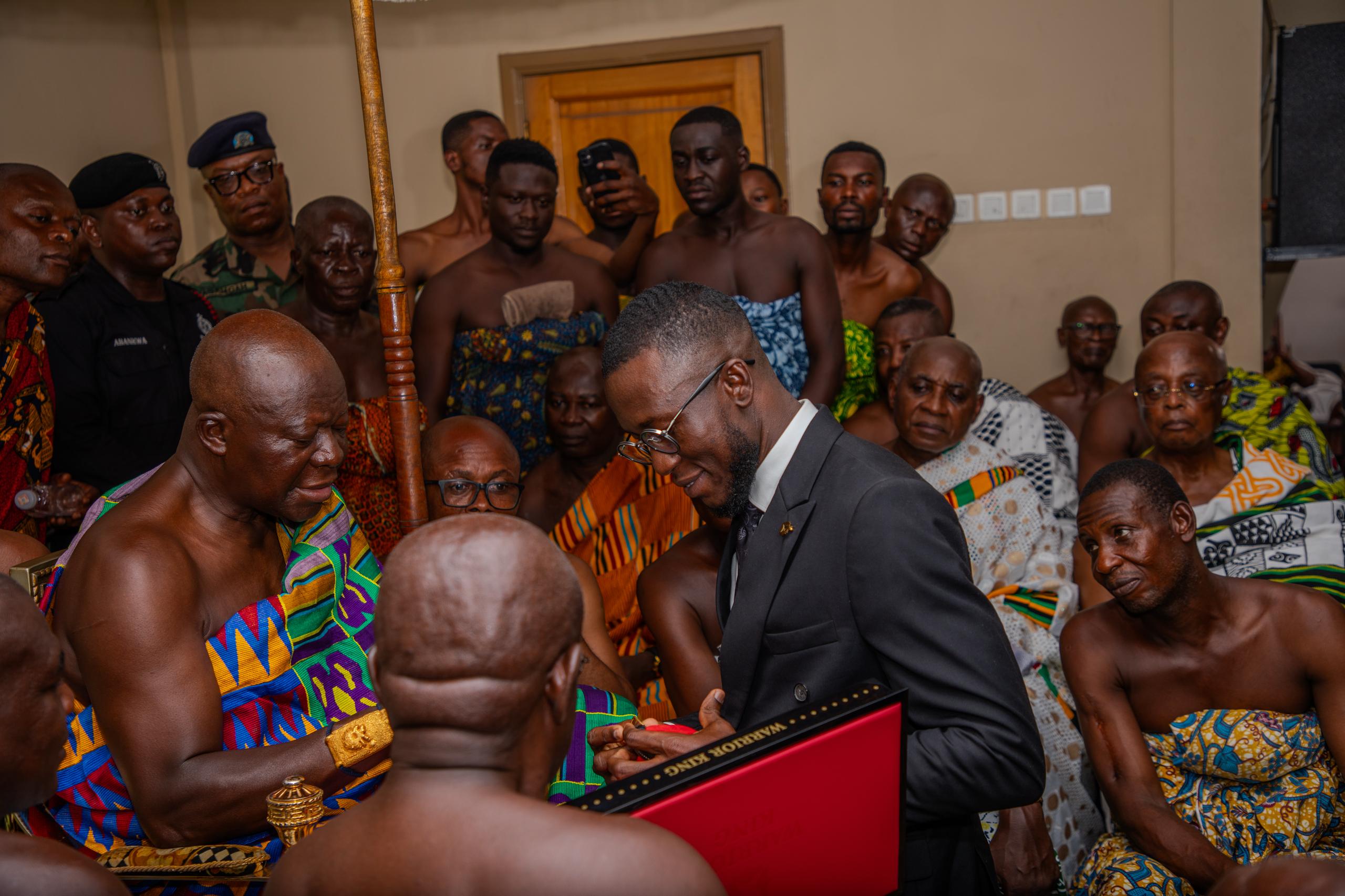 Mr. Patrick Amofah presenting the timepieces to Their Majesties